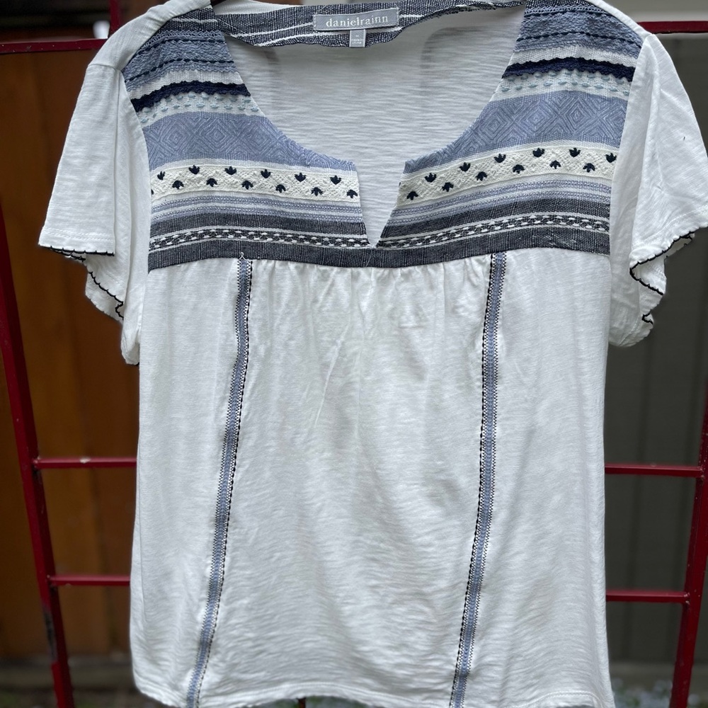 White and blue cotton blouse.